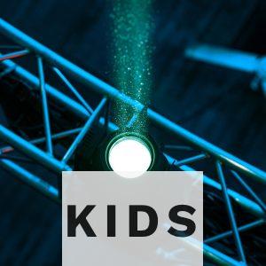 a green light is shining on a stage