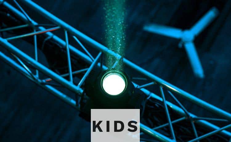 a green light is shining on a stage