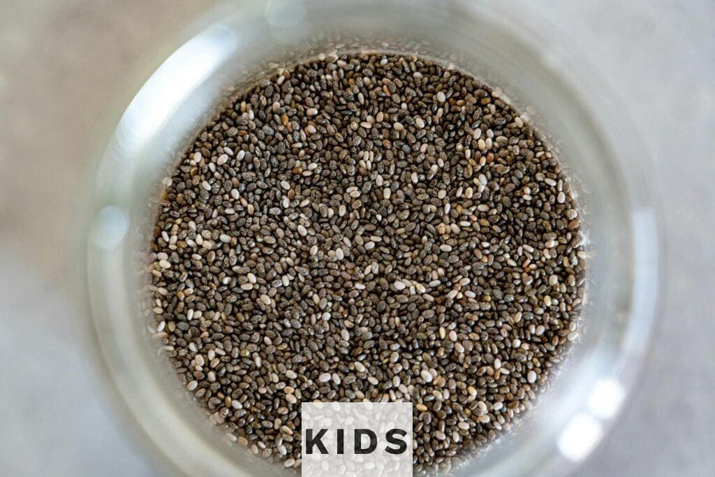 High-angle view of chia seeds in a glass jar, perfect for healthy cooking.