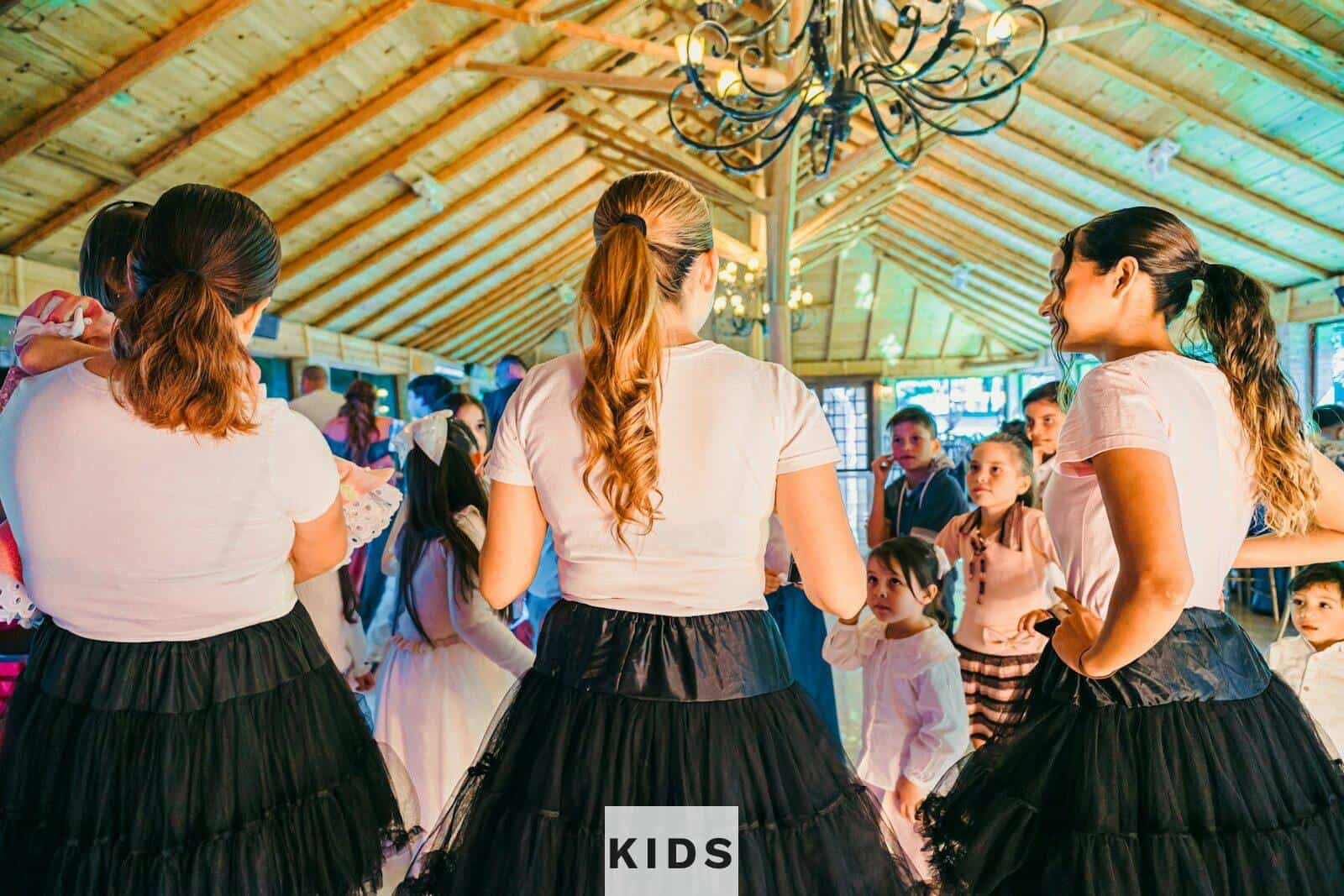 People dancing at a lively indoor gathering